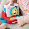 Child playing with a Fisher-Price toy camera
