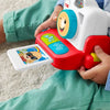 Child holding a colorful toy educational device with a smiling face