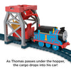 As Thomas Passes Under the hopper, the cargo drops into his car