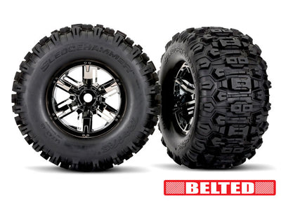 7871X  Tires & wheels, assembled, glued (X-Maxx® black chrome wheels, Sledgehammer® belted tires, dual profile (4.3" outer, 5.7" inner), foam inserts) (left & right)