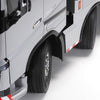 Close-up of a truck's front wheel and fender on a white background