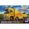 Tamiya 1:14 scale model kit box for the Volvo FH16 Globetrotter 750 8x4 Tow Truck, featuring a bright yellow tow truck illustration on the packaging with Tamiya branding.