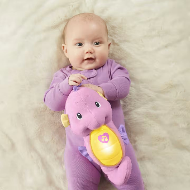 "Soft pink seahorse toy with glowing light and lullabies for babies